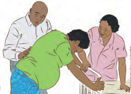 Parents helping pregnant person